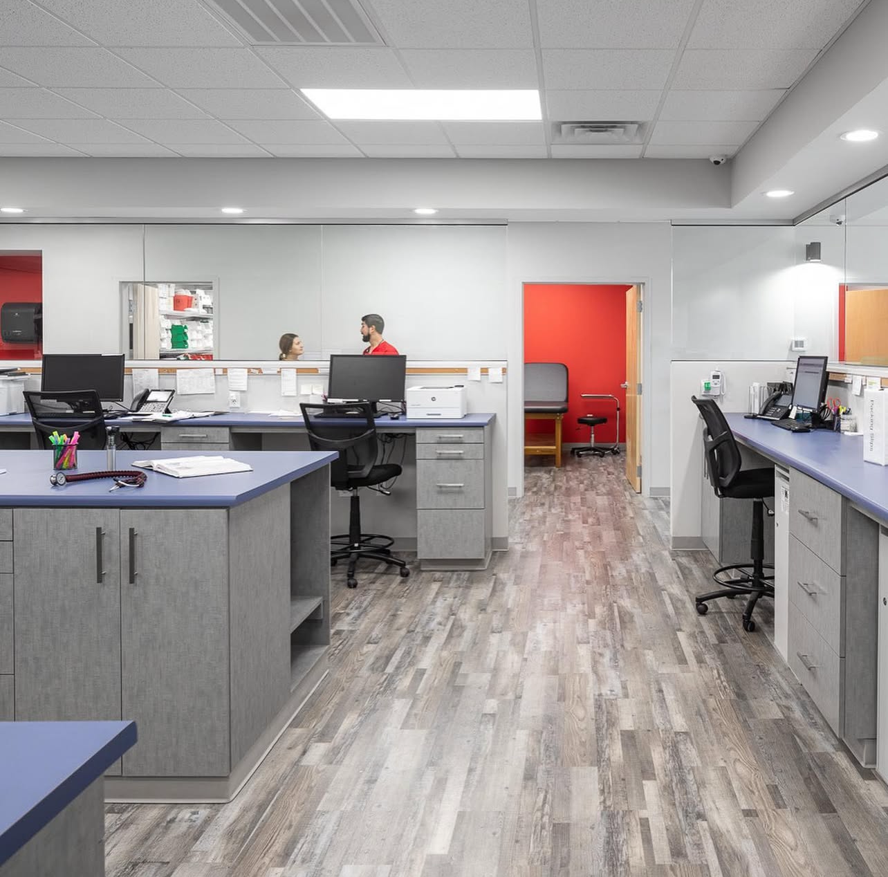 A large office with a lot of desks and chairs