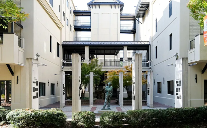 A building with a statue in the middle of it