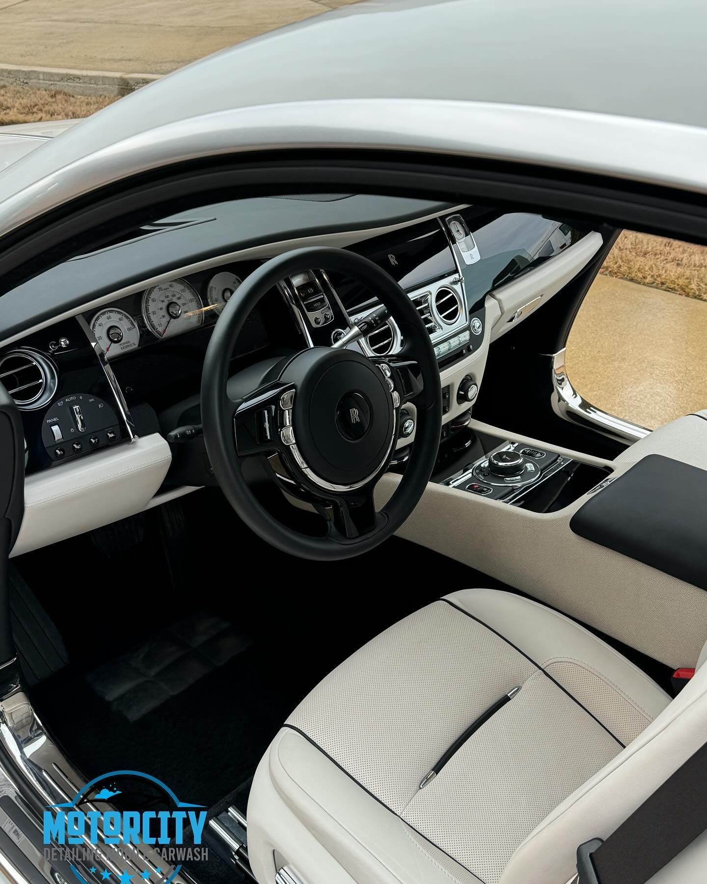 A picture of the inside of a car with the word motorcity on the bottom