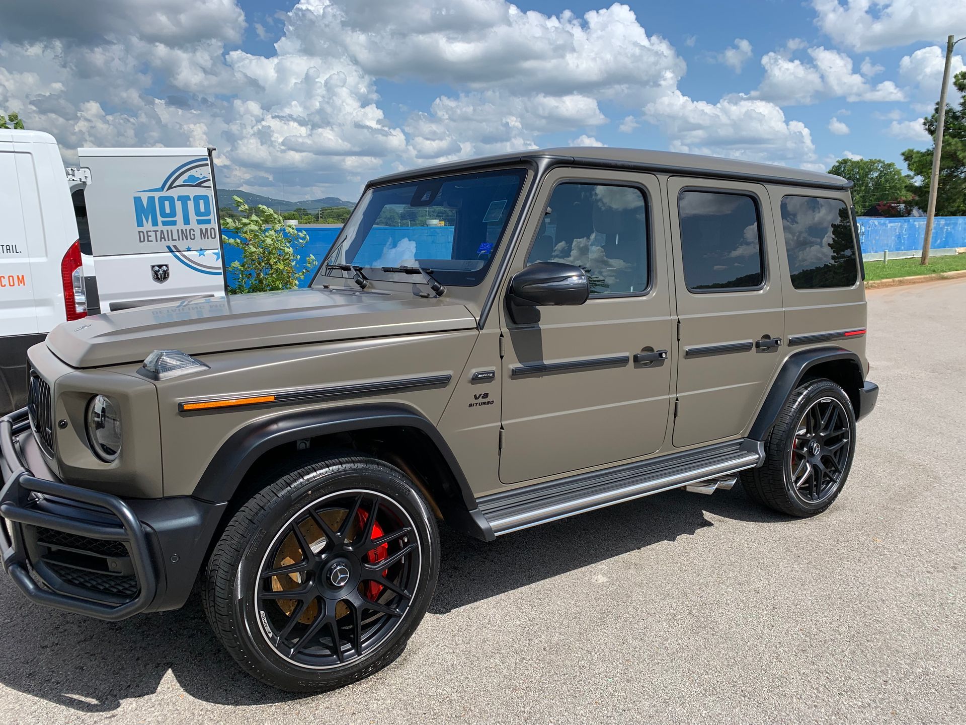 A mercedes benz g63 amg is parked in a parking lot.