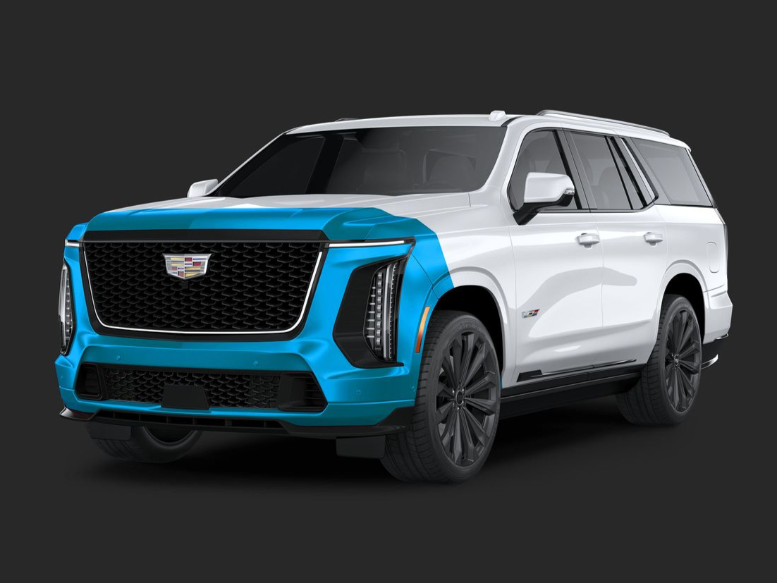 A white porsche 911 with blue trim on a black background.