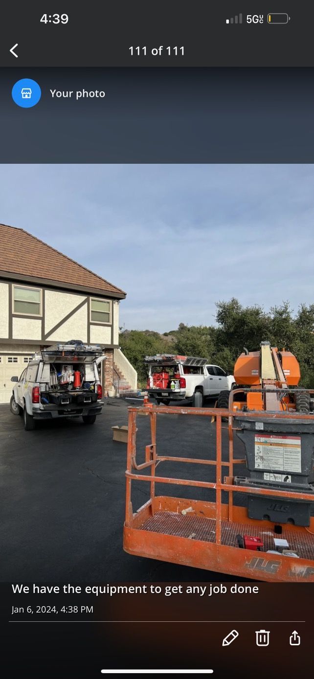 a car is parked in front of a house next to a lift