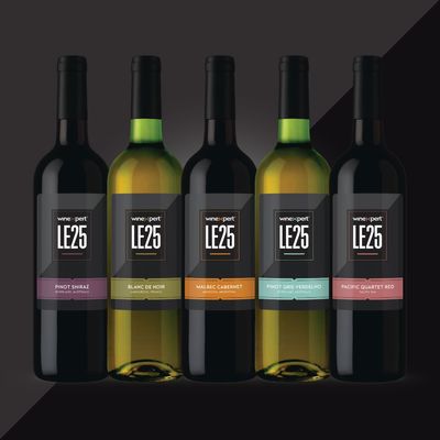 Five wine bottles with black labels displaying
