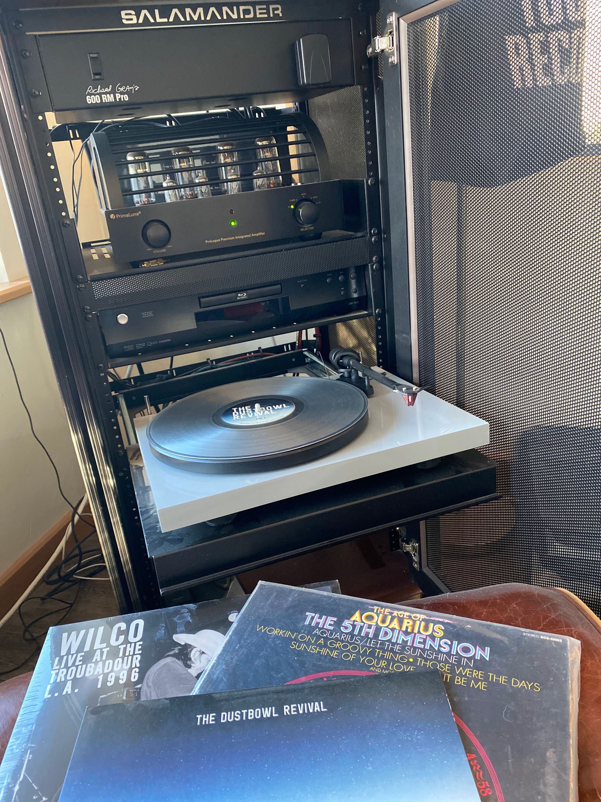 A record player is sitting on top of a record player.