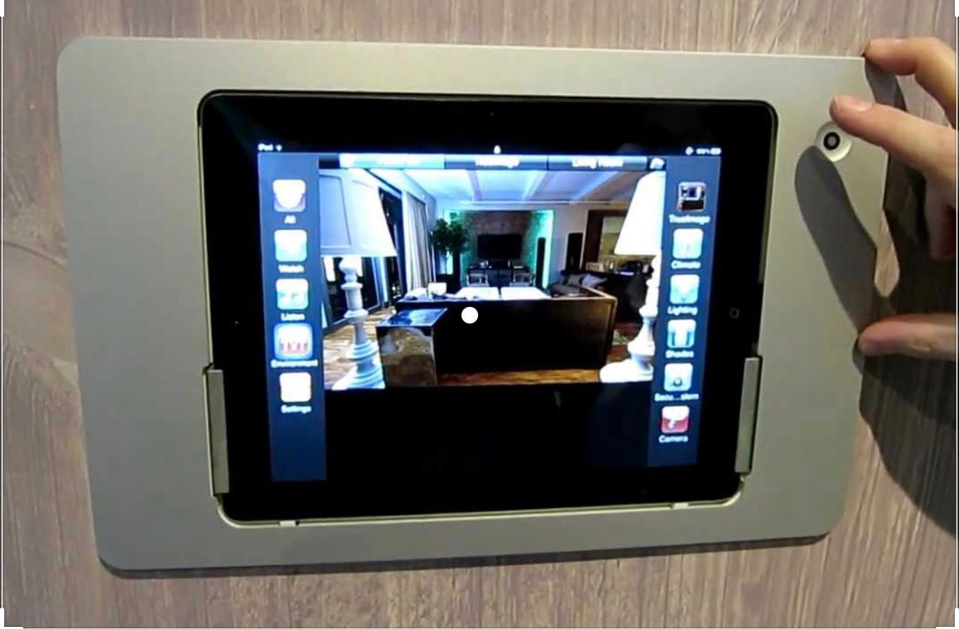A tablet with a picture of a living room on it