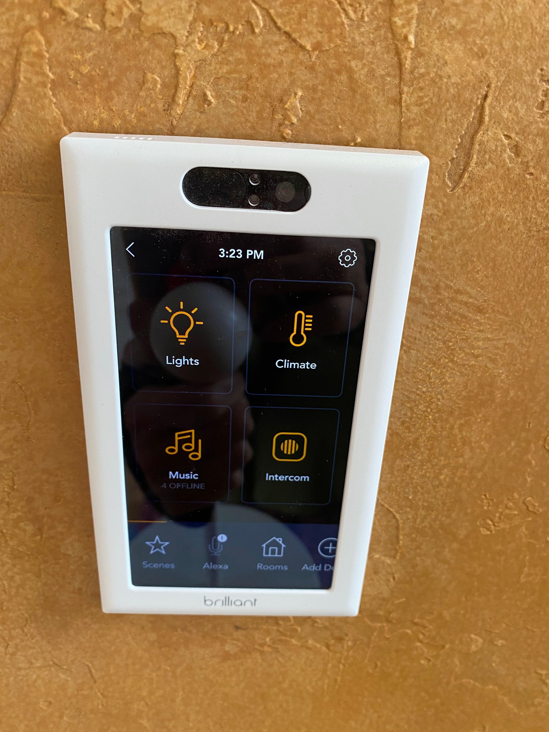 A smart phone sitting on top of a wall.