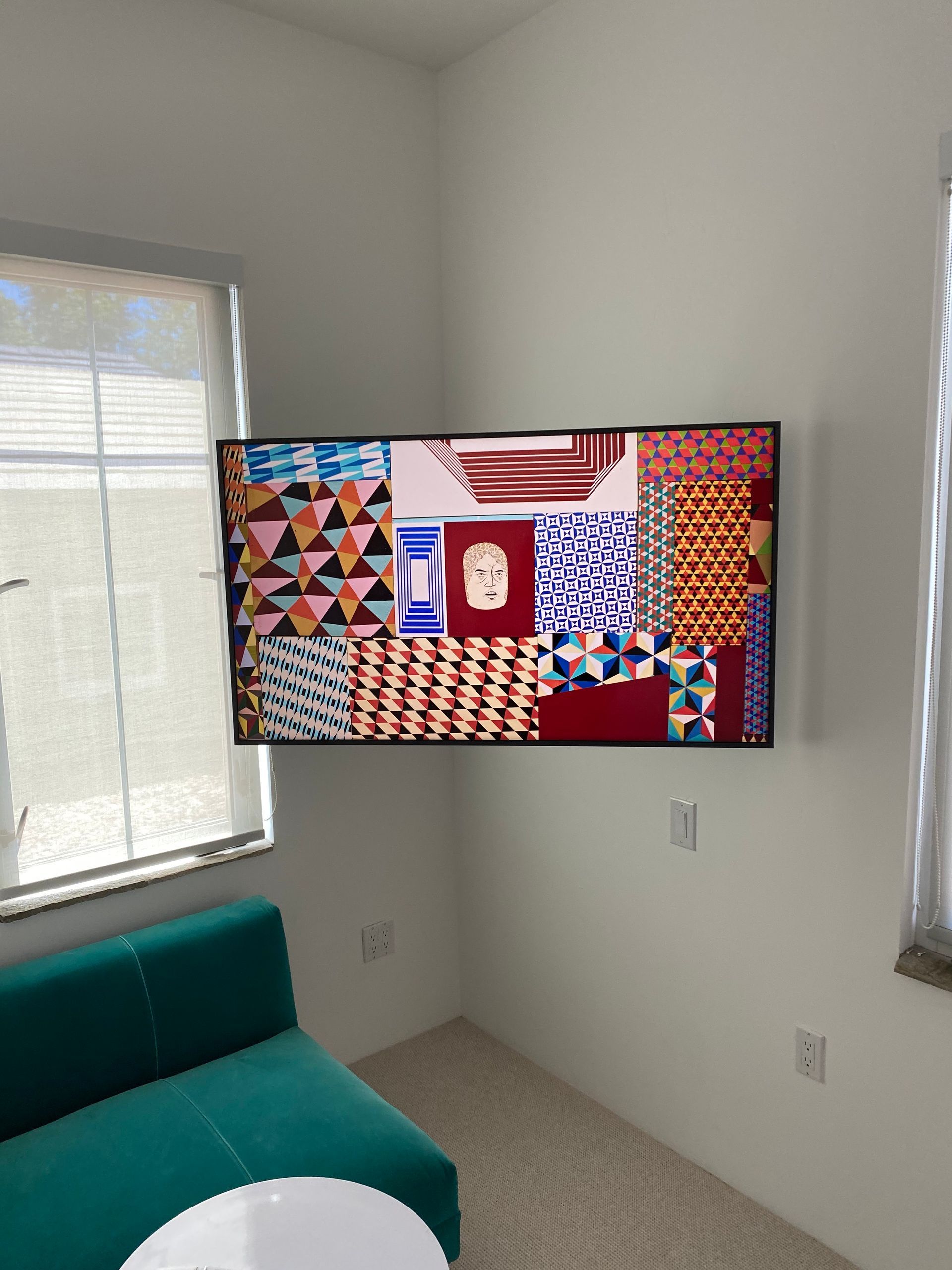 A living room with a couch and a flat screen tv