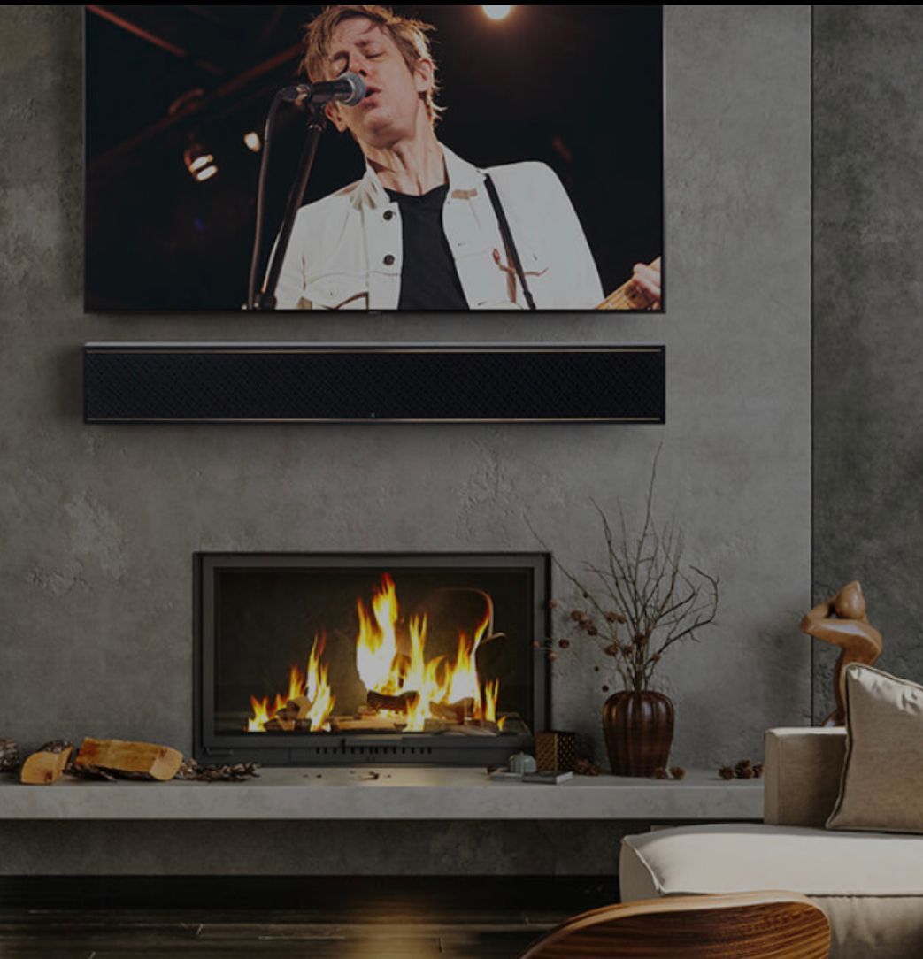 A living room with a fireplace and a flat screen tv