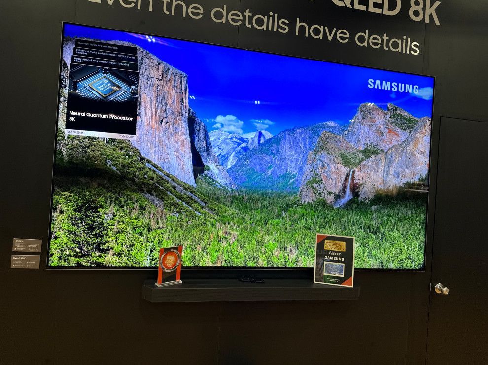 A samsung tv with a picture of a mountain on it