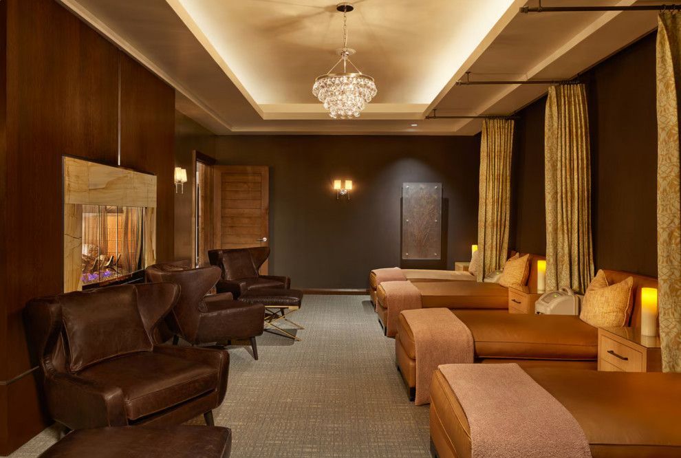 A room with a lot of beds and chairs in it