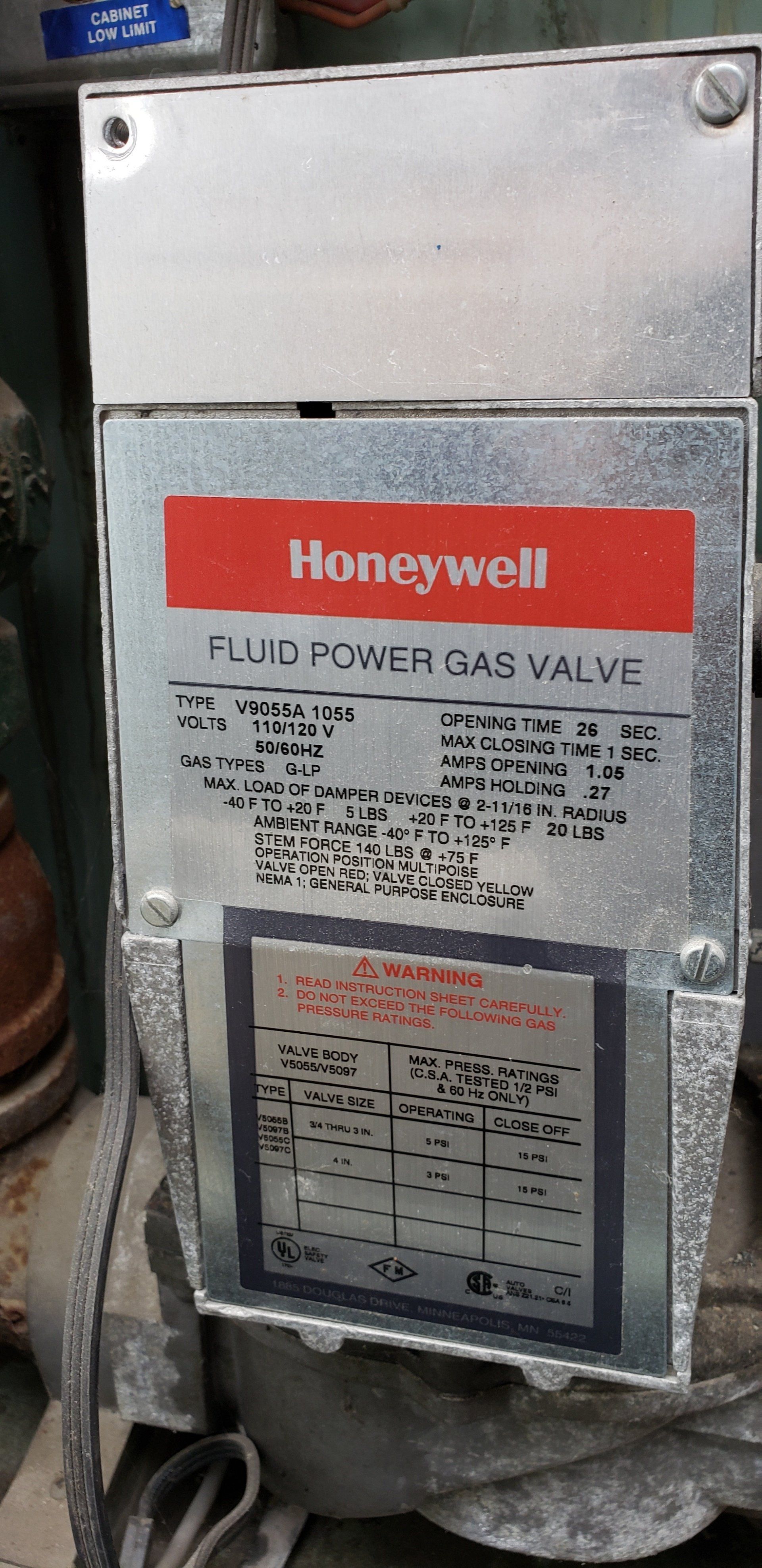 A honeywell gas valve is sitting on a table.