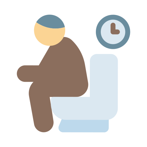 Un hombre está sentado en un baño con un reloj a su lado.