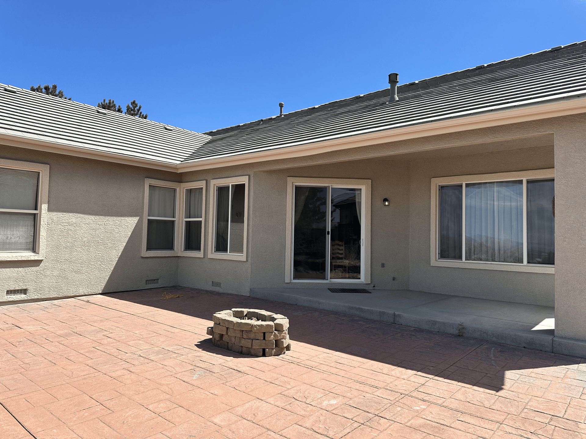 A house with a fire pit in front of it