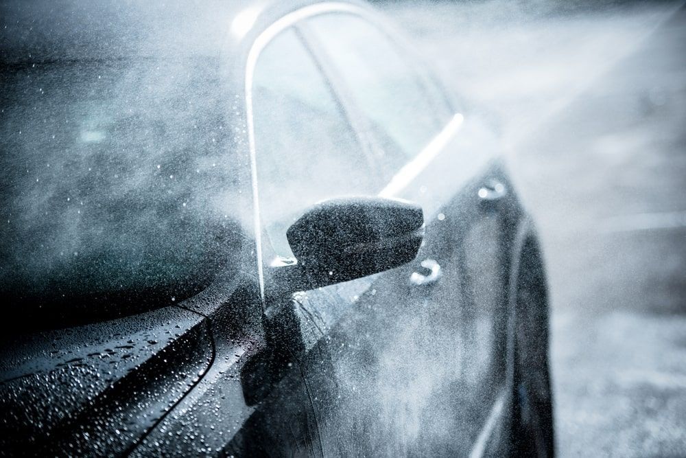 A Close Up Of A Car Being Washed In The Rain — Rocky Car Wash In Berserker, QLD