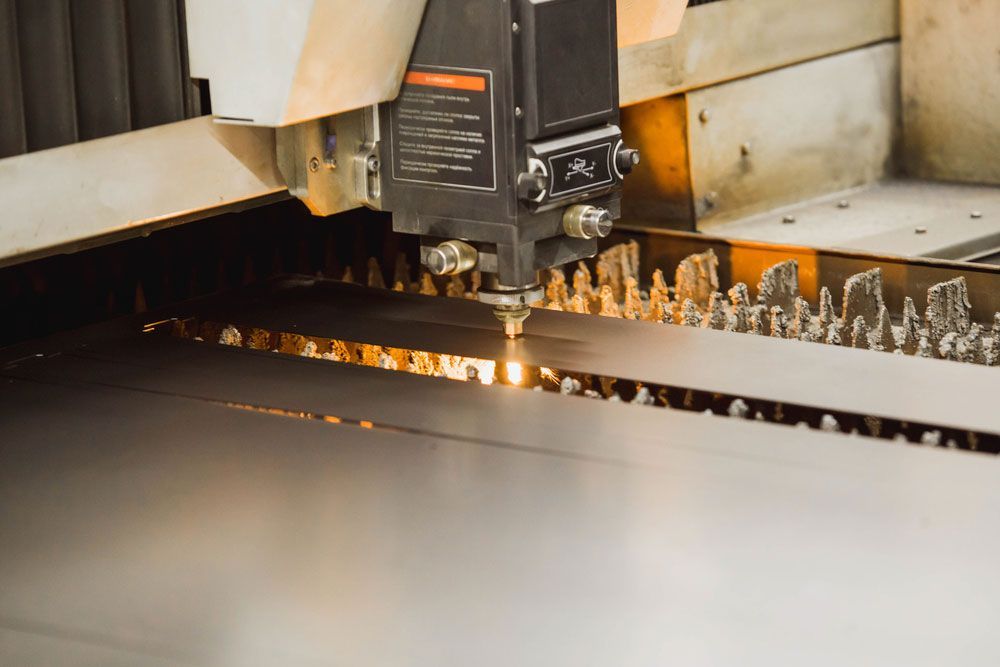 A Machine Is Cutting A Piece Of Metal In A Factory — Industrial Automation Australia in Eagle Farm, QLD