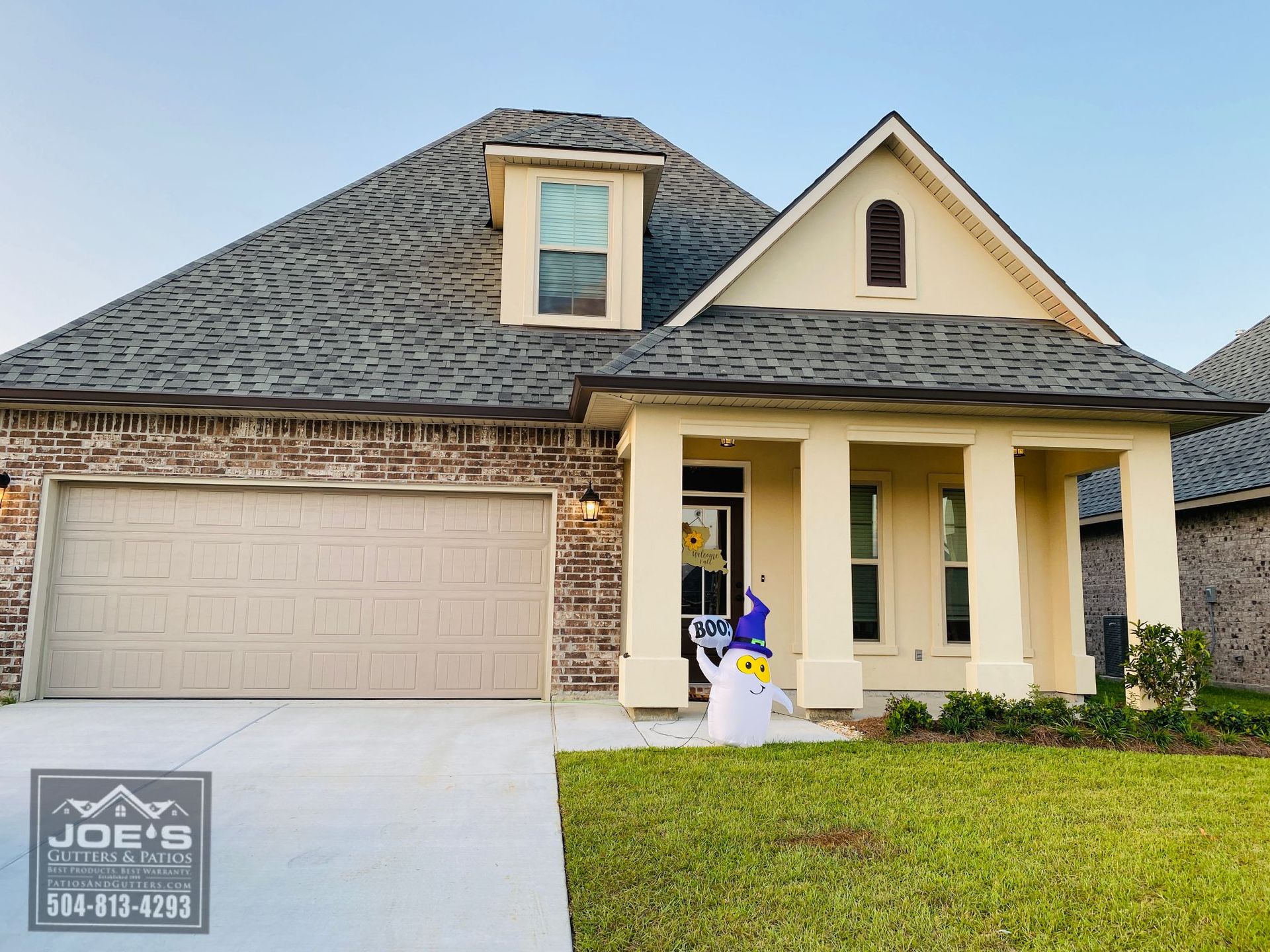 A house with a snowman in front of it