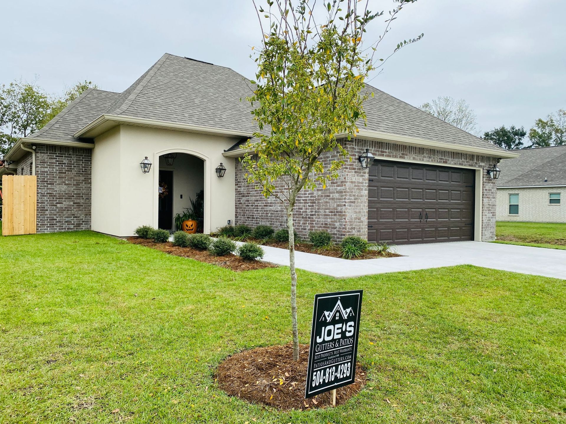 A house with a sign in front of it that says `` for sale ''.