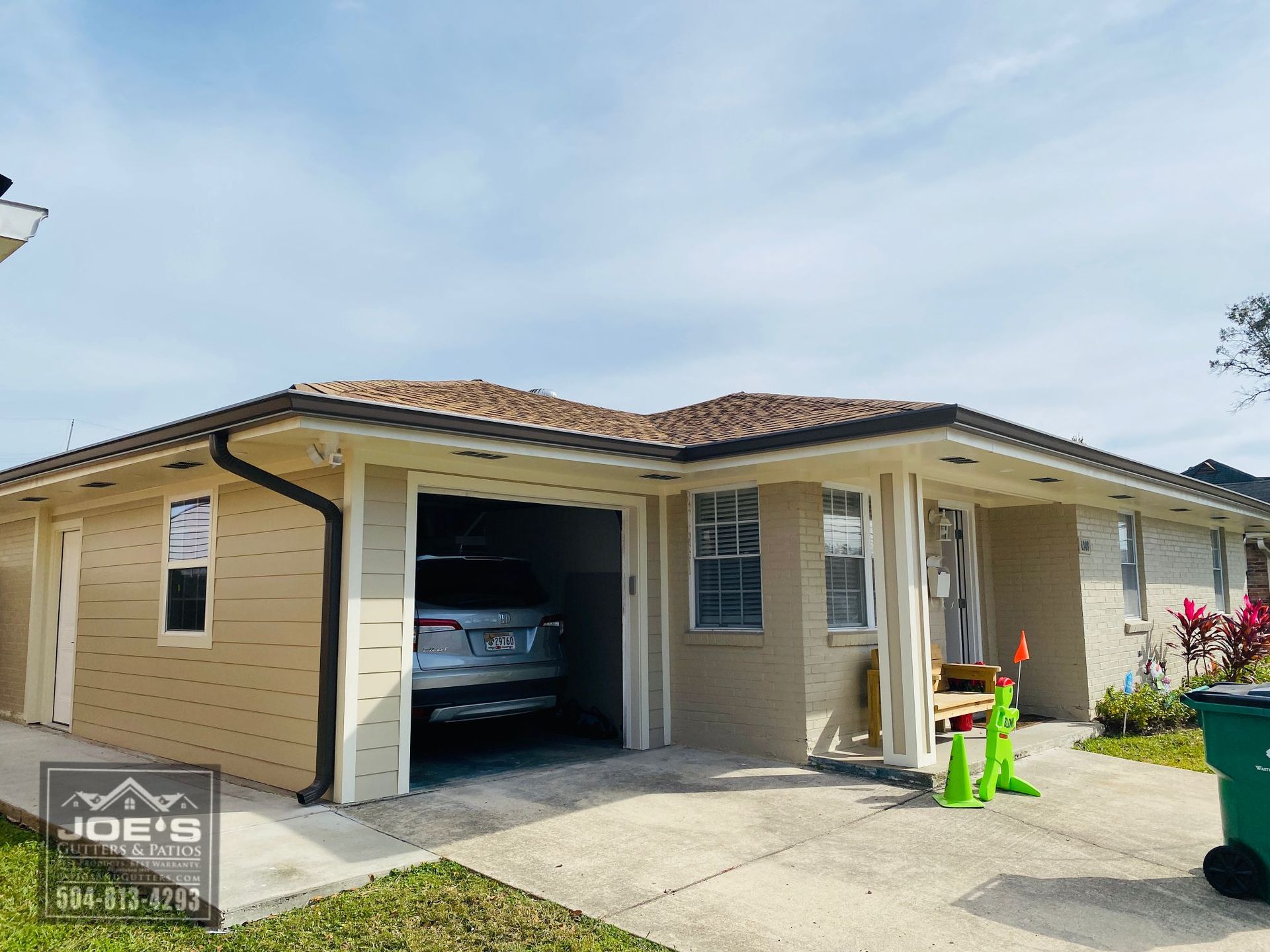 A car is parked in the garage of a house.