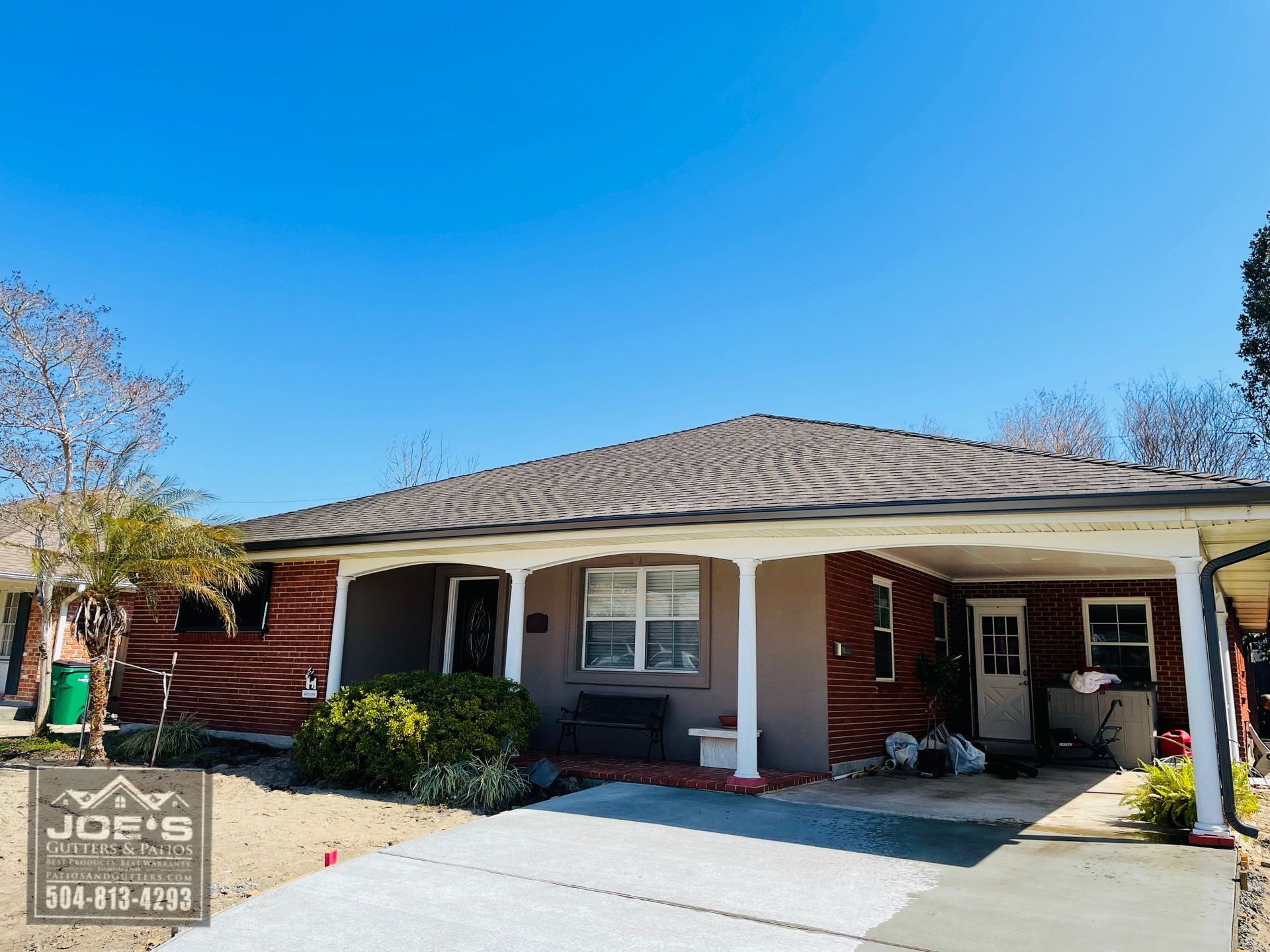 A house with a porch and a roof is for sale.