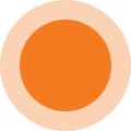 A solid orange circle centered within a larger, pale peach-colored circle.