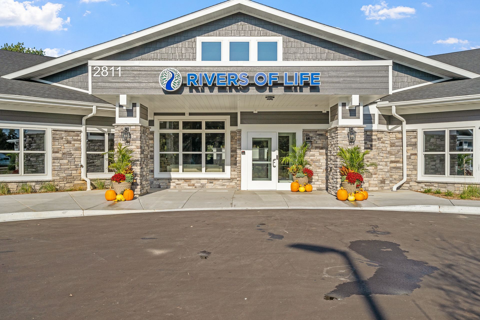 A large building with a sign that says river of life