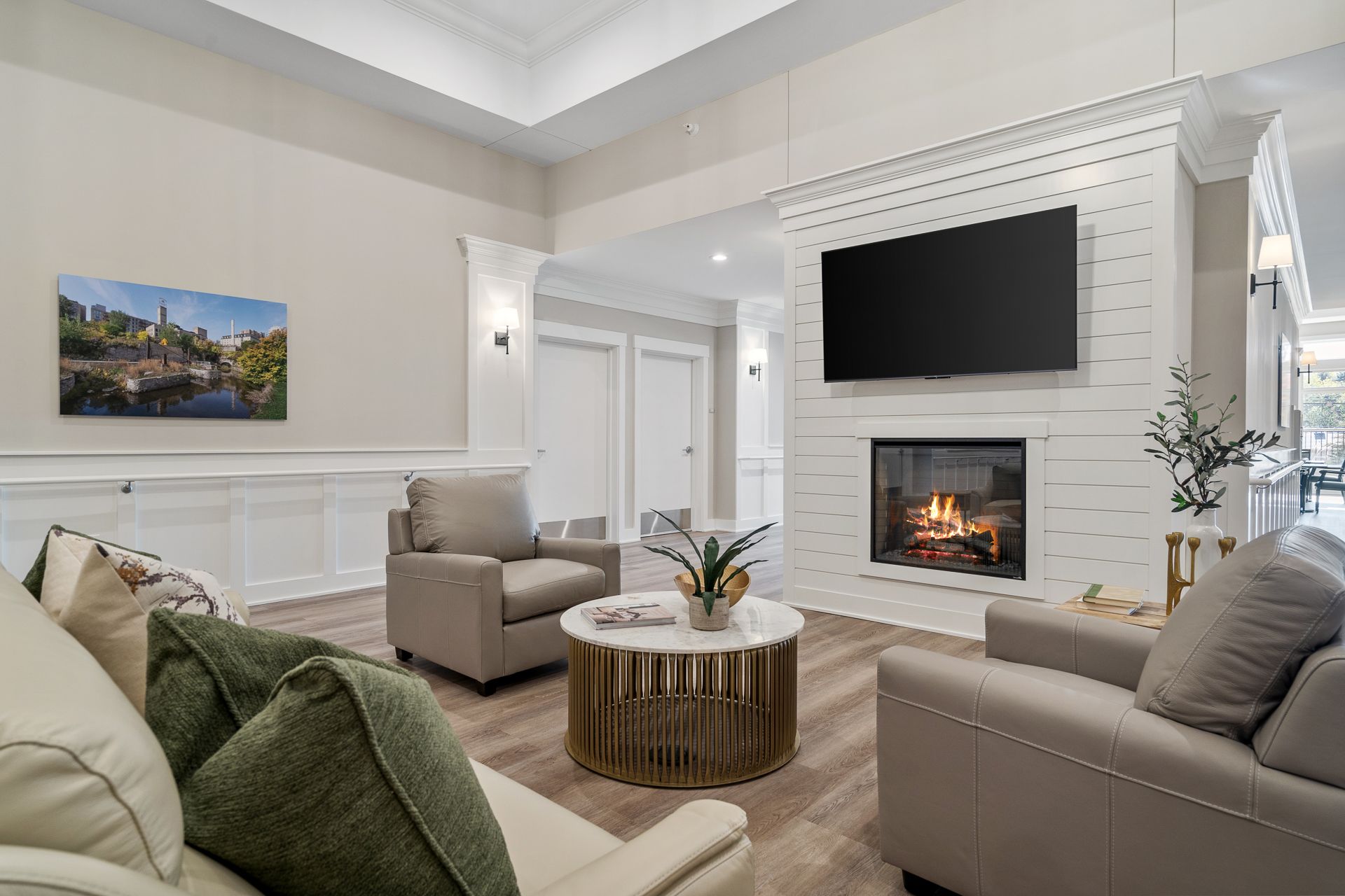 A living room with a fireplace and a flat screen tv.