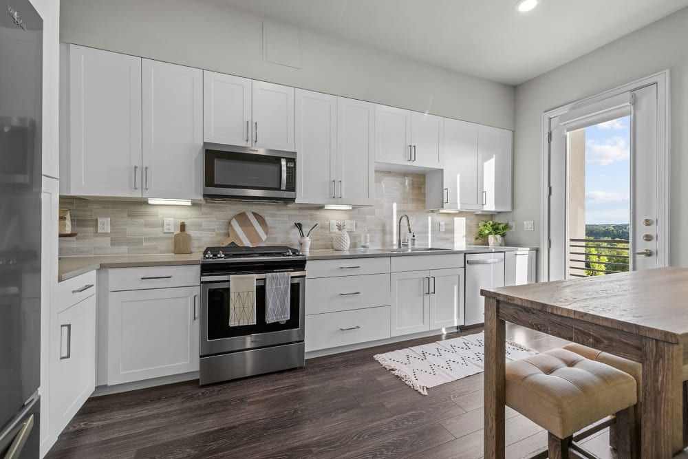 Modern Kitchen with White Cabinets at The Clark