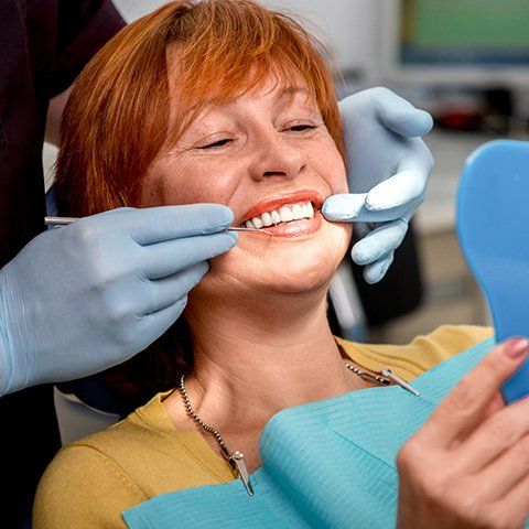 Mature Woman Having a Dental Checkup — Burleigh Denture Clinic in Burleigh Heads, QLD