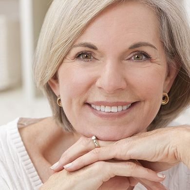 Beautiful Mature Woman Smiling — Burleigh Denture Clinic in Burleigh Heads, QLD