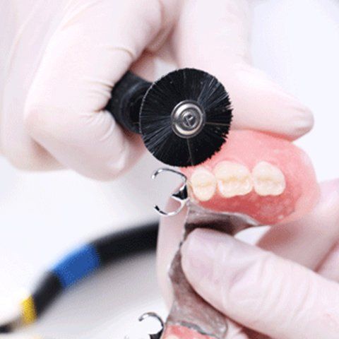 Man Repairing the Denture — Burleigh Denture Clinic in Burleigh Heads, QLD