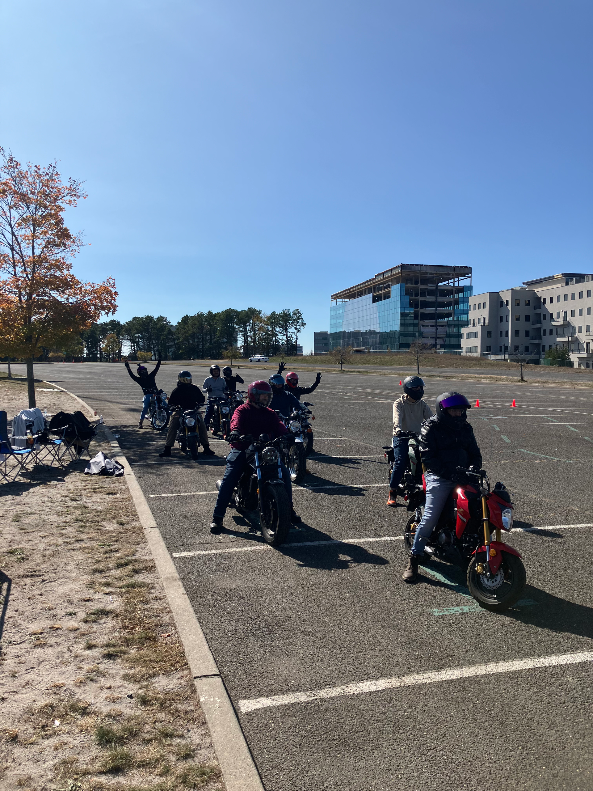 A man is riding a motorcycle down a road.