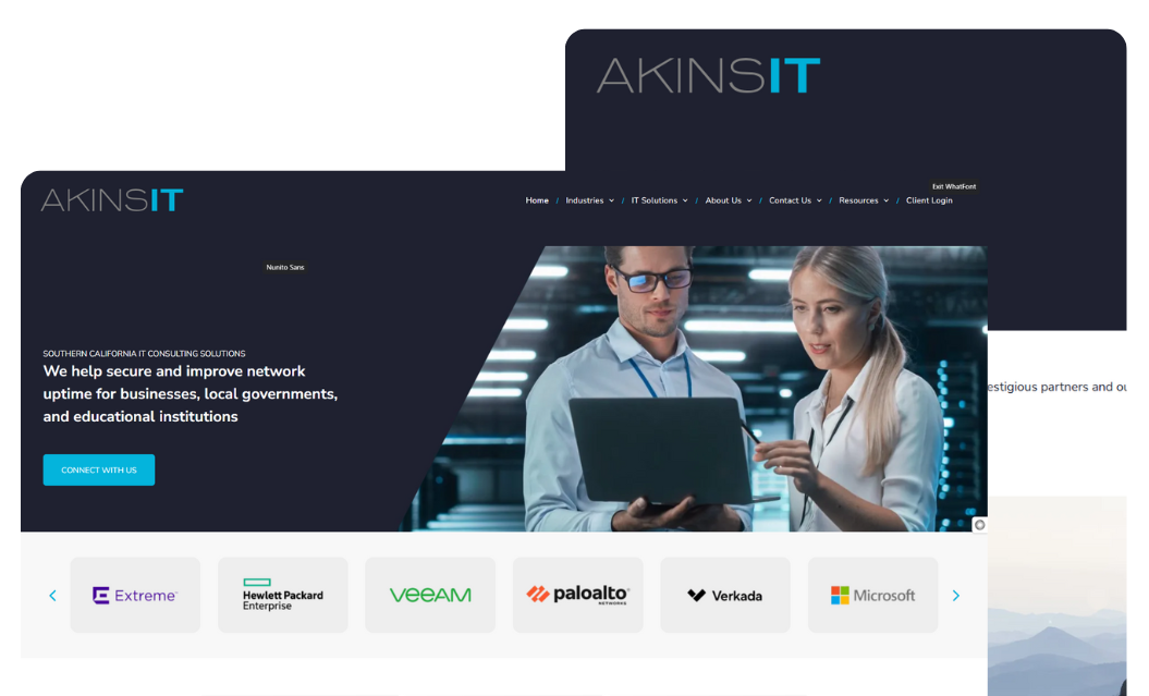 A man and a woman are looking at a laptop on a website.