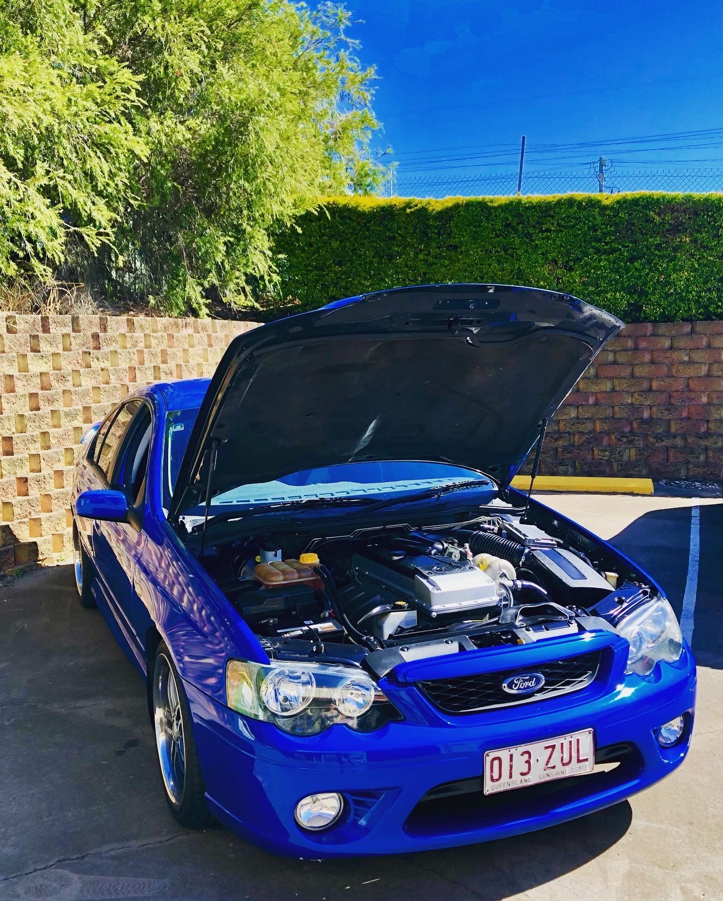 Blue Ford with bonnet open — Trusted Mechanic in Hervey Bay