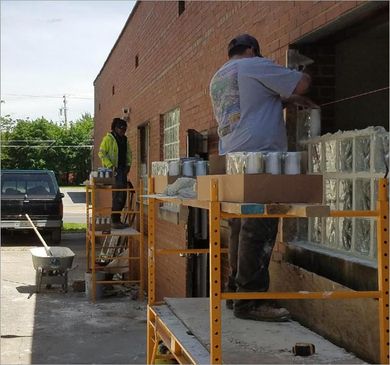 Contractors attaching window glass - construction services north ridgeville oh