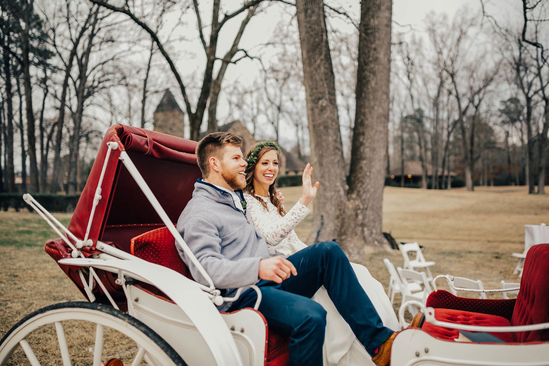 bride and groom in a horse carriage on the castle grounds wedding venue in little rock arkansas