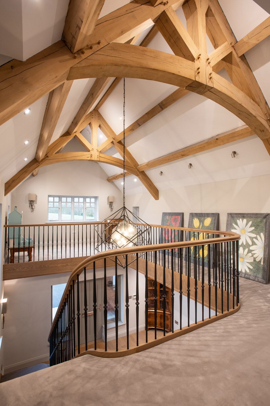 New build Cheshire property showing elegant staircase and exposed timber beams
