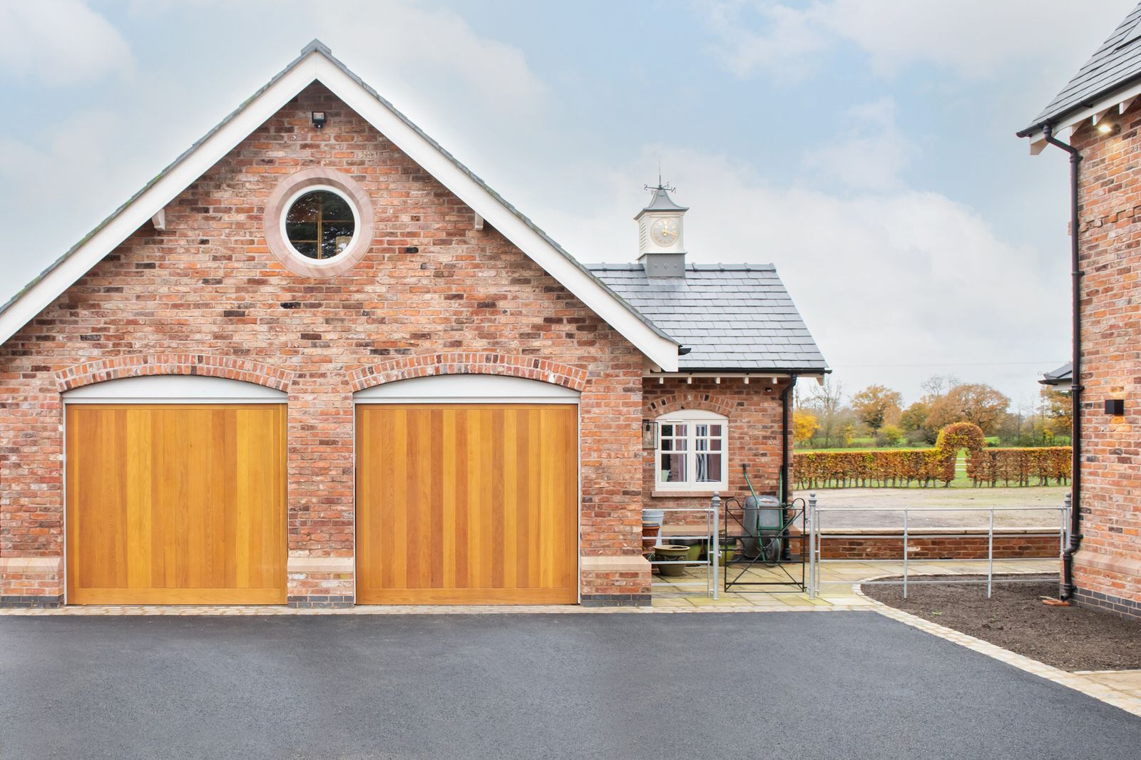 Luxury new build Cheshire residence featuring a double garage and landscaped surroundings