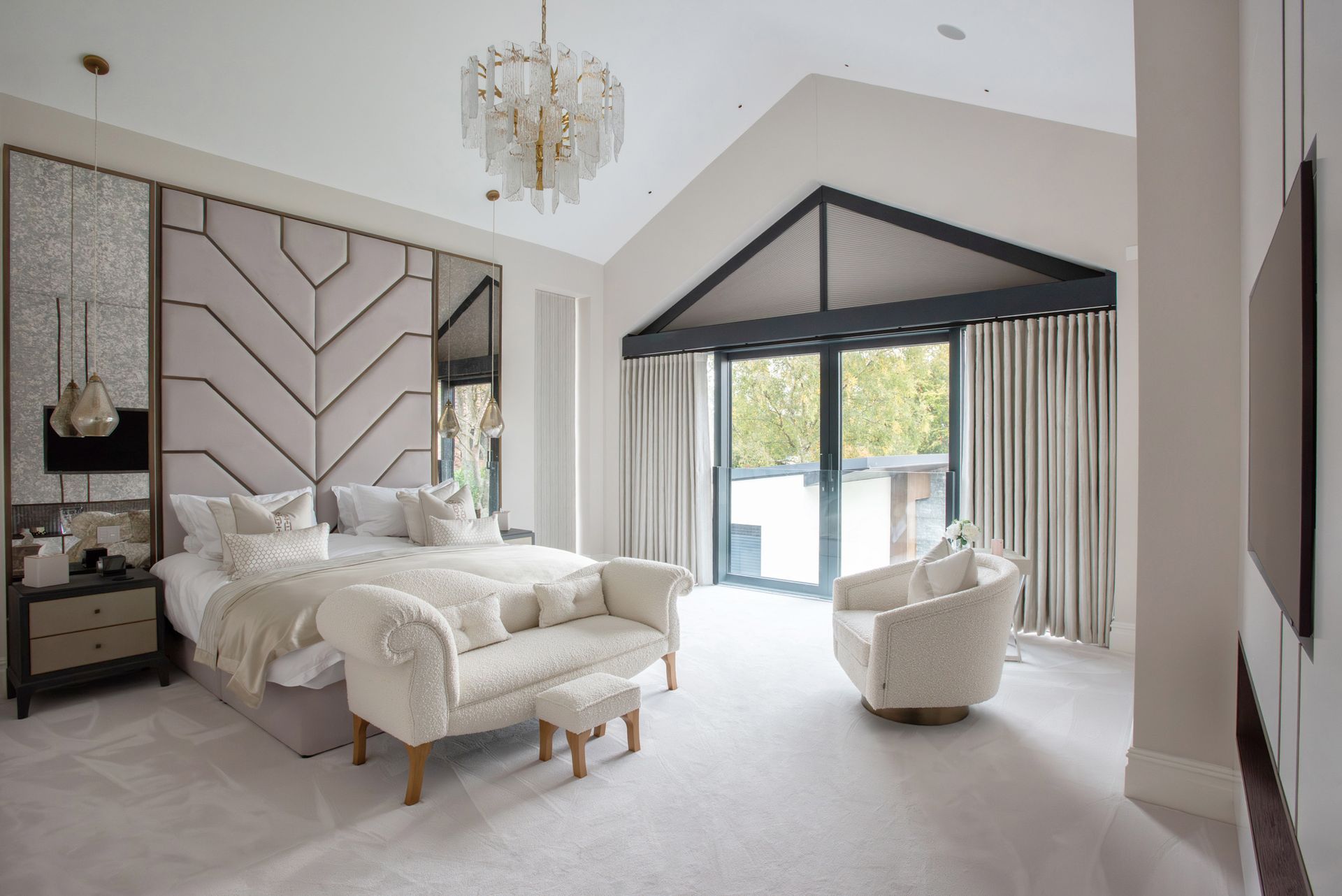 Master bedroom suite in luxury new build Sandbach home constructed by Rawlinson Construction with neutral décor and natural light