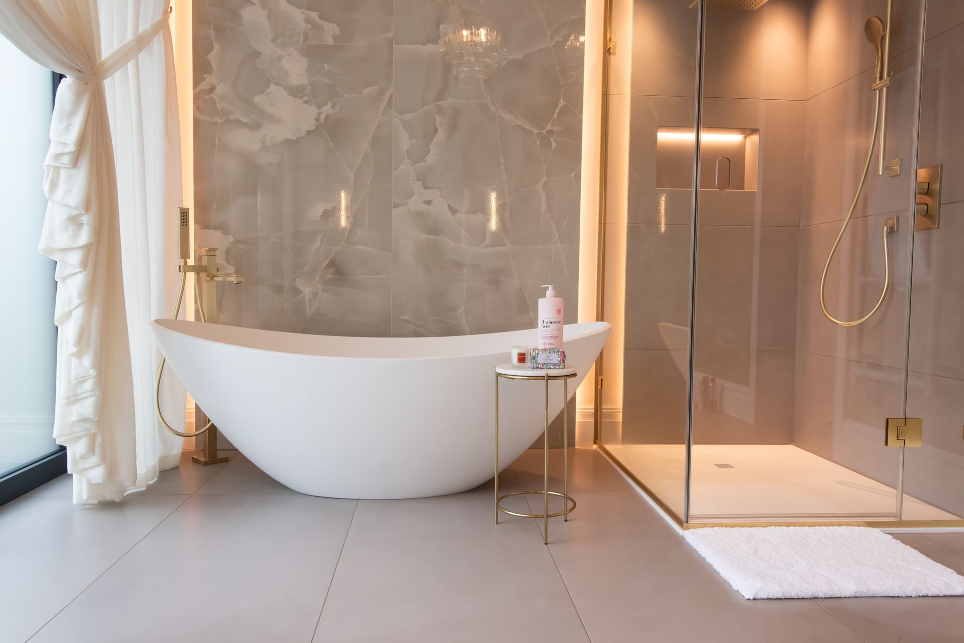 Luxury family bathroom with freestanding bath and contemporary fittings in Sandbach property constructed by Rawlinson Construction