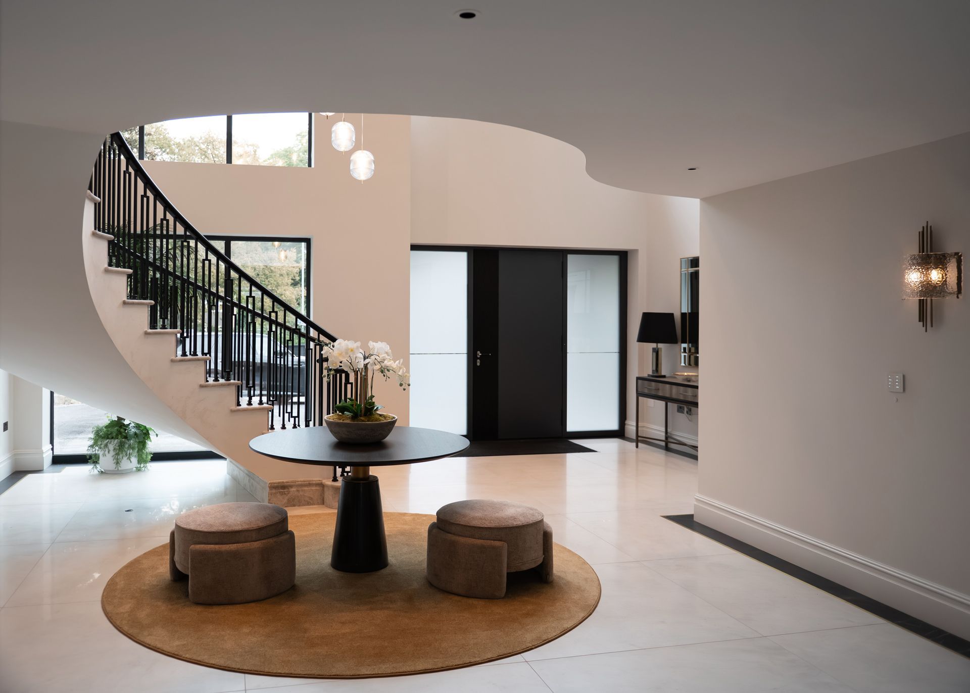 Spacious entrance hall in bespoke Cheshire new build constructed by Rawlinson Construction with modern finishes and natural light