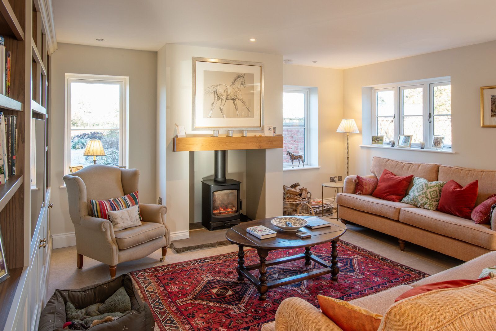 Spacious lounge in Cheshire farmhouse-style home featuring log burner