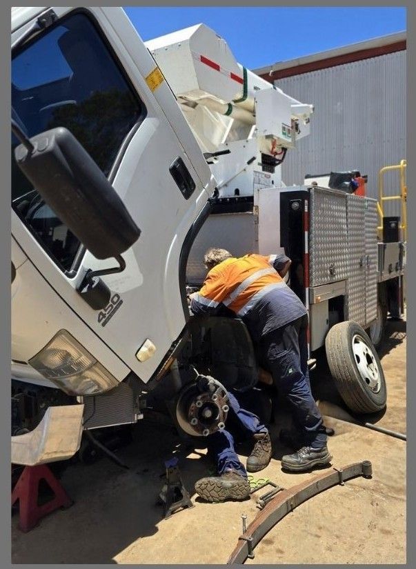 Two Men Working On A Truck — Central Diesel Services In Alice Springs, NT