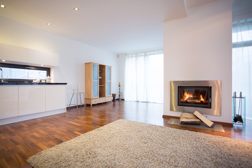 A Minimalist Living Room With a Lit Fireplace — Unger Air in Quirindi, NSW
