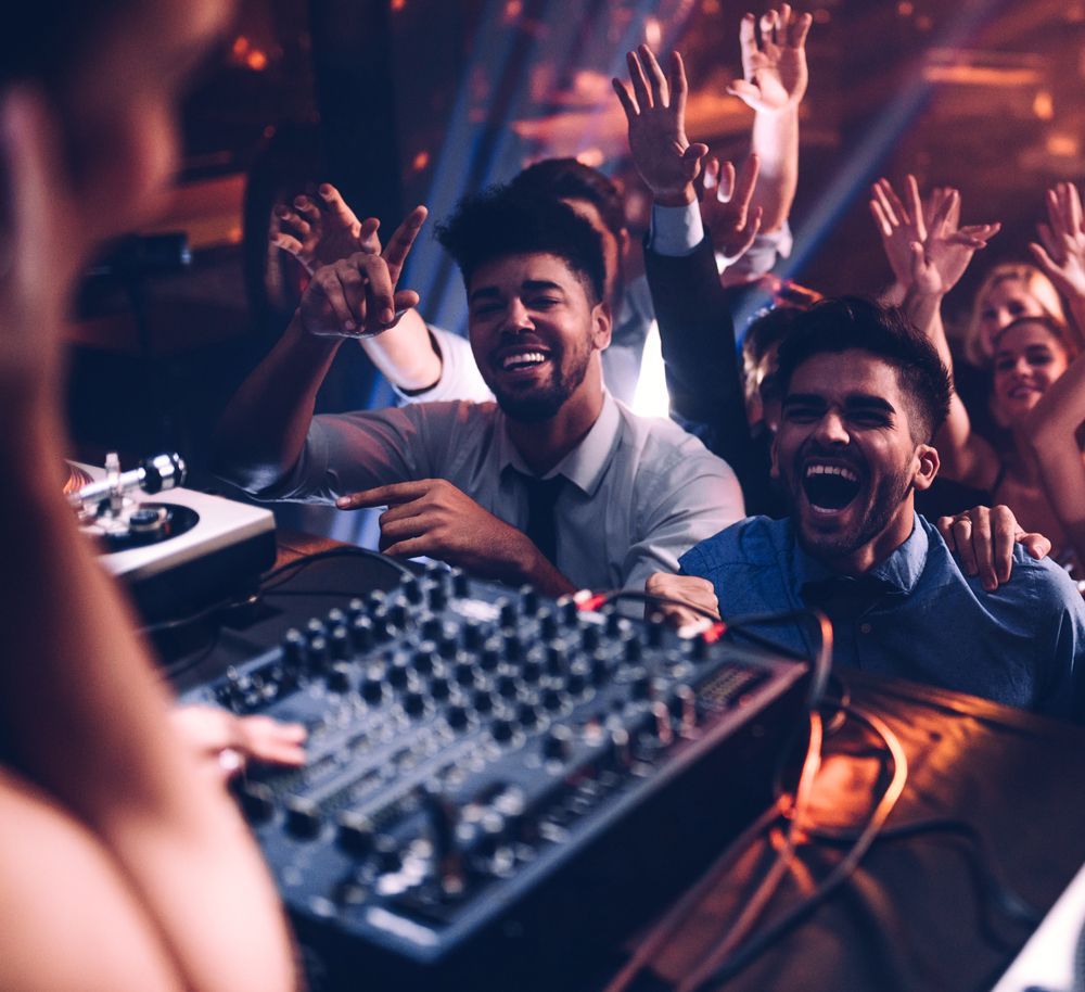 People Enjoying DJ's Music