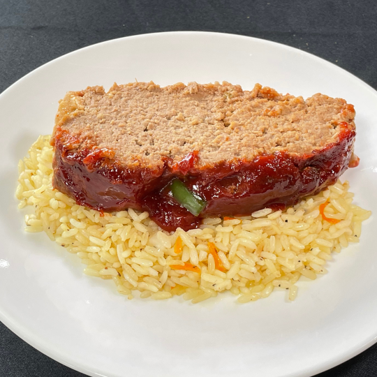 Meat loaf over sassy rice