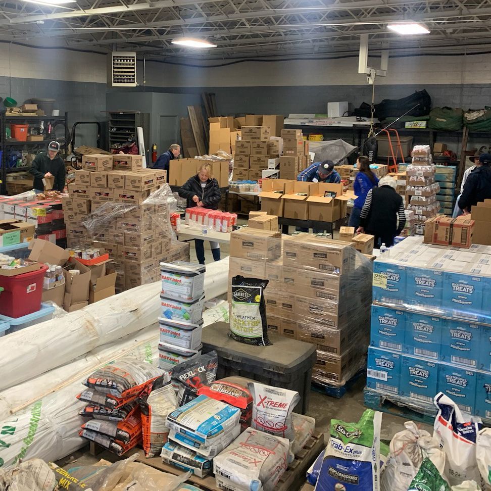 A large warehouse filled with lots of boxes and bags