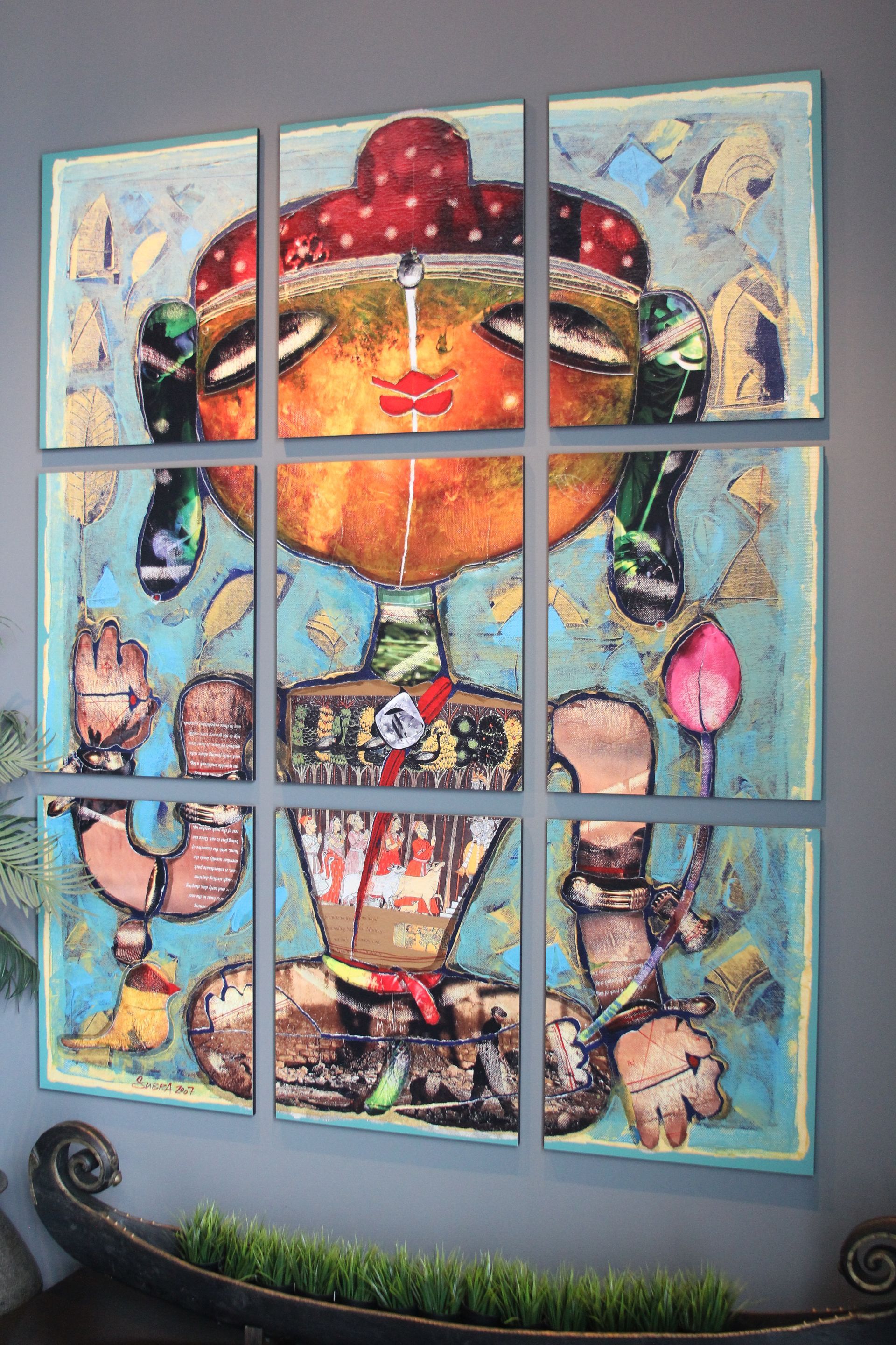 A painting of a woman sitting in a lotus position on a wall