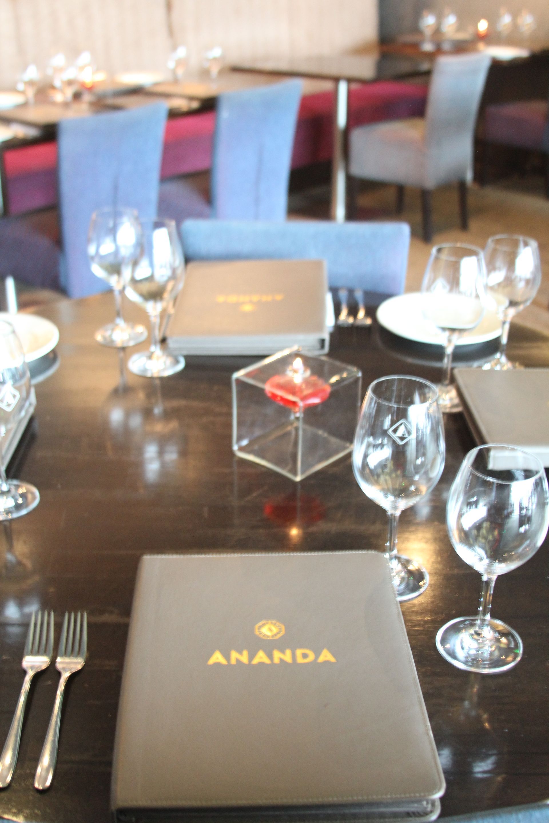 A restaurant with a menu that says ananda on it
