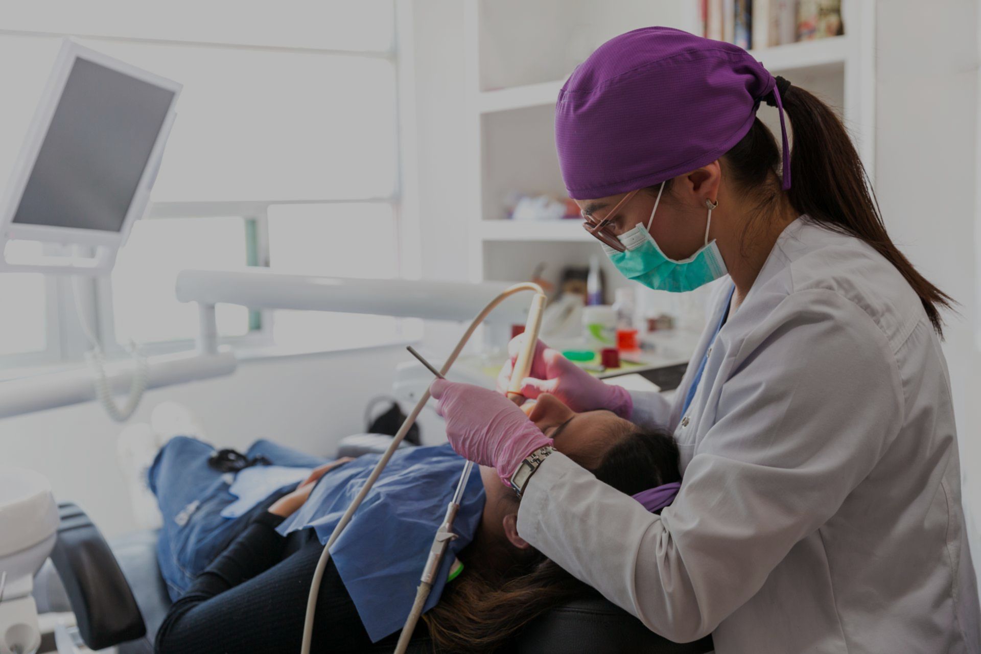 Dentist showing women patient x-rays of teeth