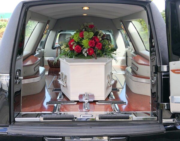 Coffin In The Vehicle — Quality Cremation Services in Rockhampton, QLD